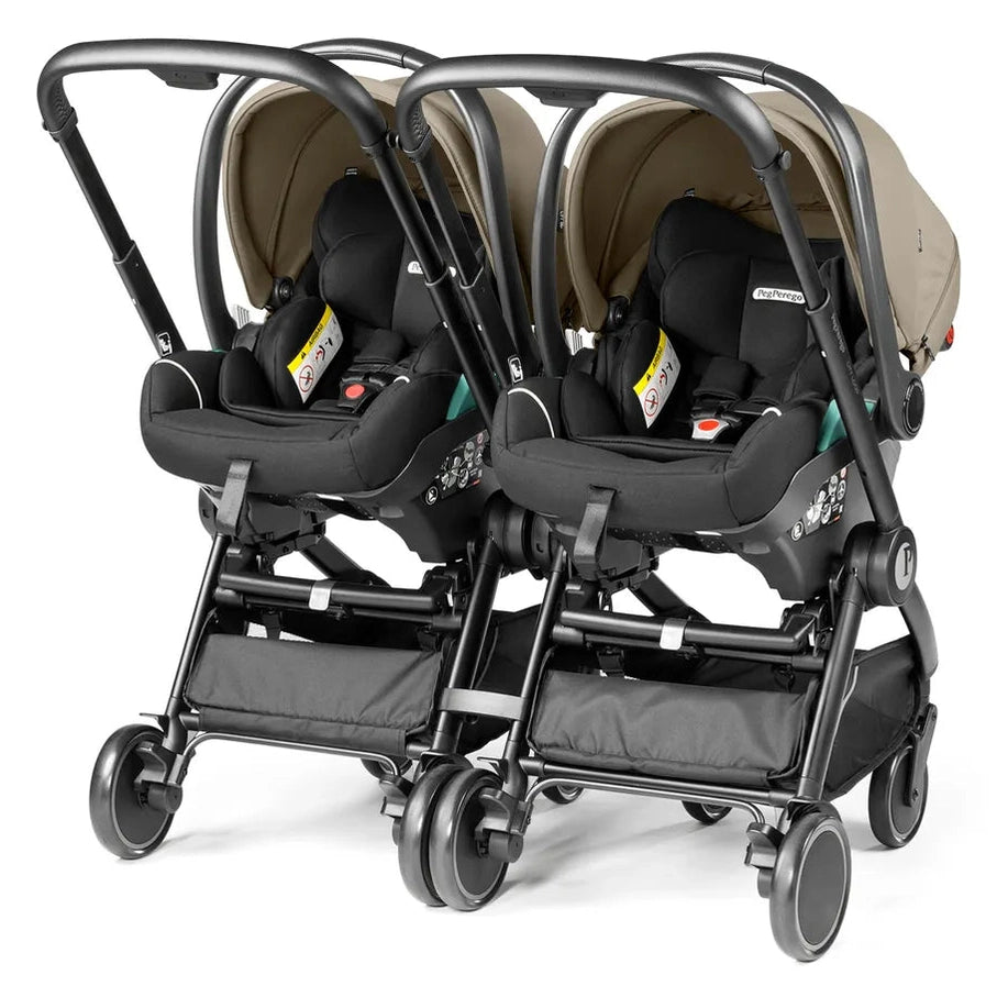 Peg Perego Duo Adapter for City Loop, twin infant car seats mounted side by side on a black City Loop stroller.