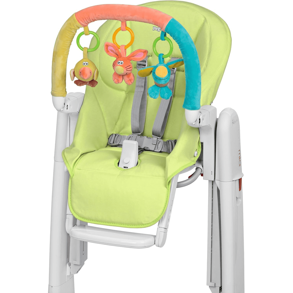 Peg Perego Play Bar on lime high chair, with colorful plush toys hanging from a soft arch.