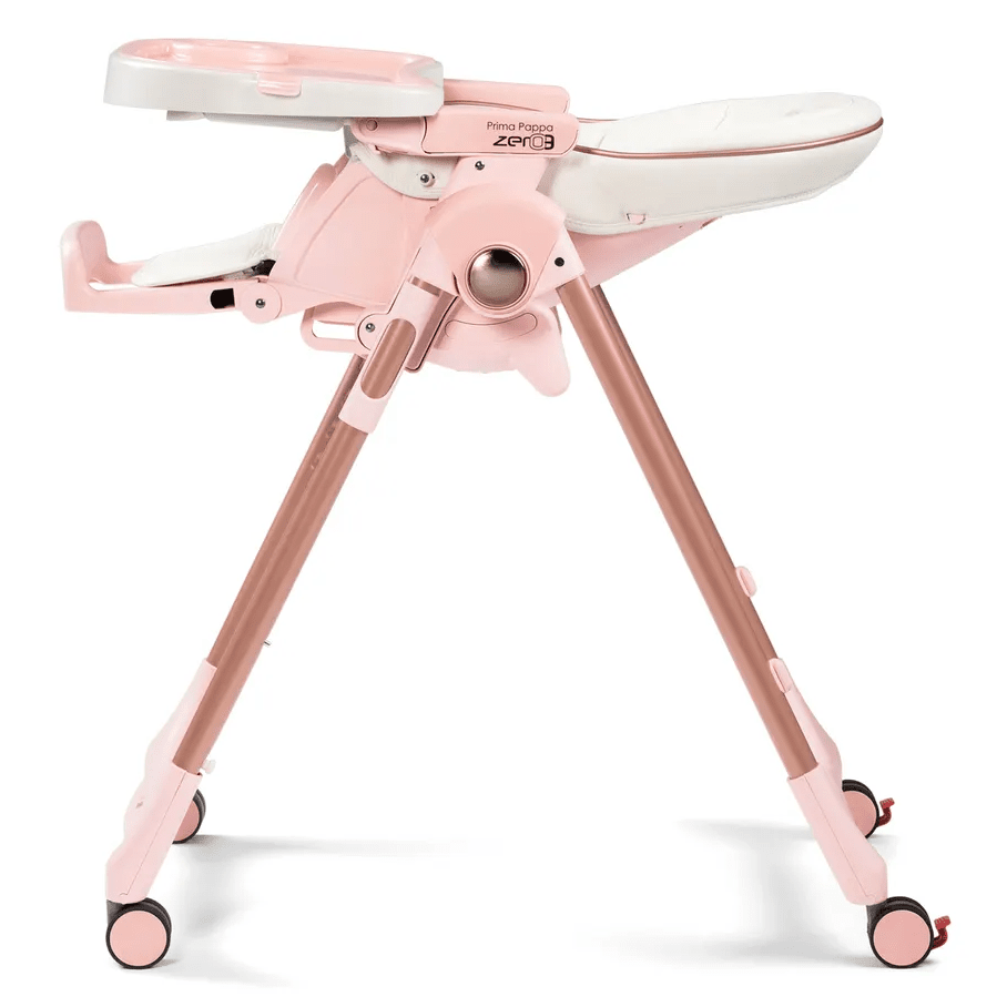 Peg Perego Prima Pappa Zero 3 high chair in pink with adjustable legs and wheels for easy mobility.