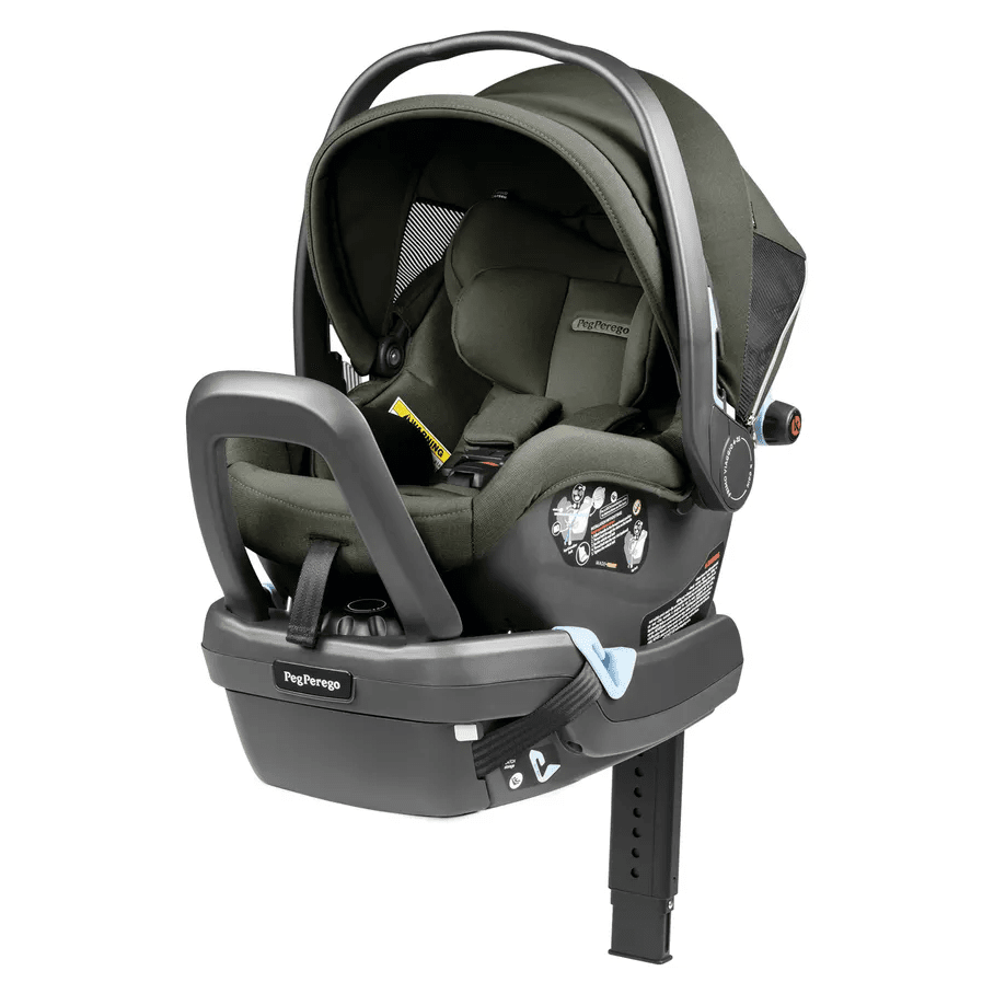 Peg Perego Primo Viaggio Nido Infant Car Seat in olive green, with base and supporting leg attached for secure car travel.