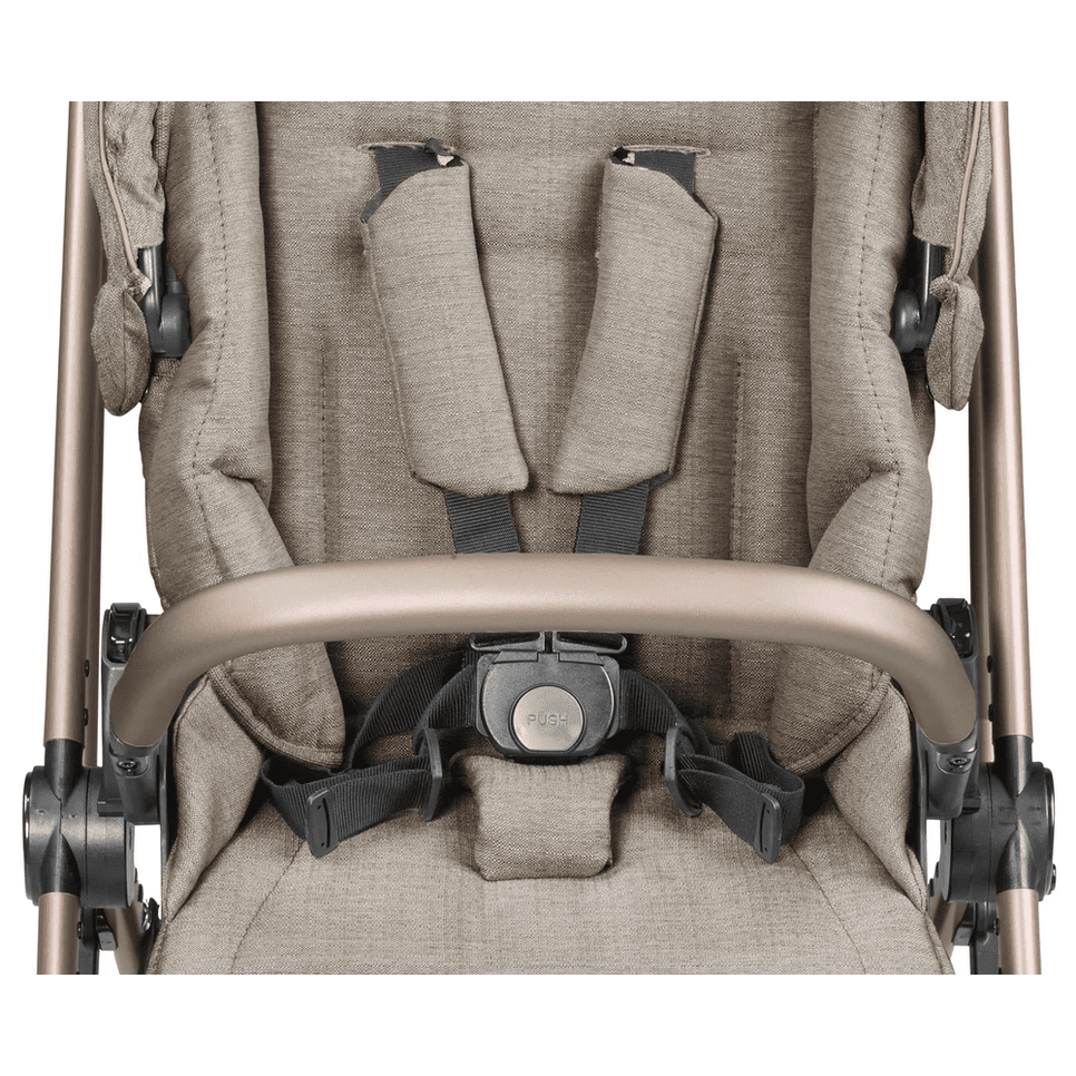 Peg Perego Vivace Stroller with beige fabric, 5-point harness, safety front bar, and foot muff attached.