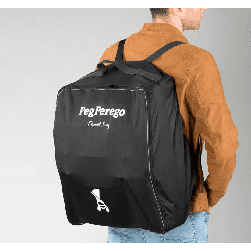 Peg Perego VOLO Travel Stroller bag in black with white logo, worn as a backpack by a man.