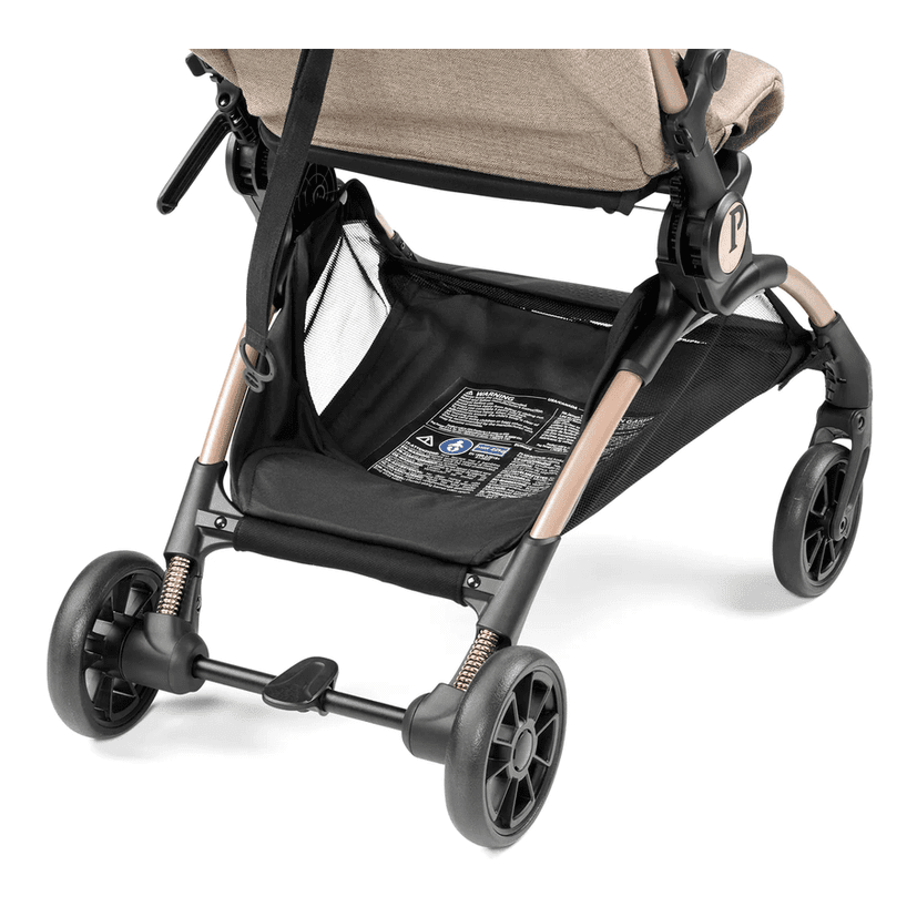 Peg Perego VOLO Travel Stroller in beige/black with under-seat storage basket and four wheels.