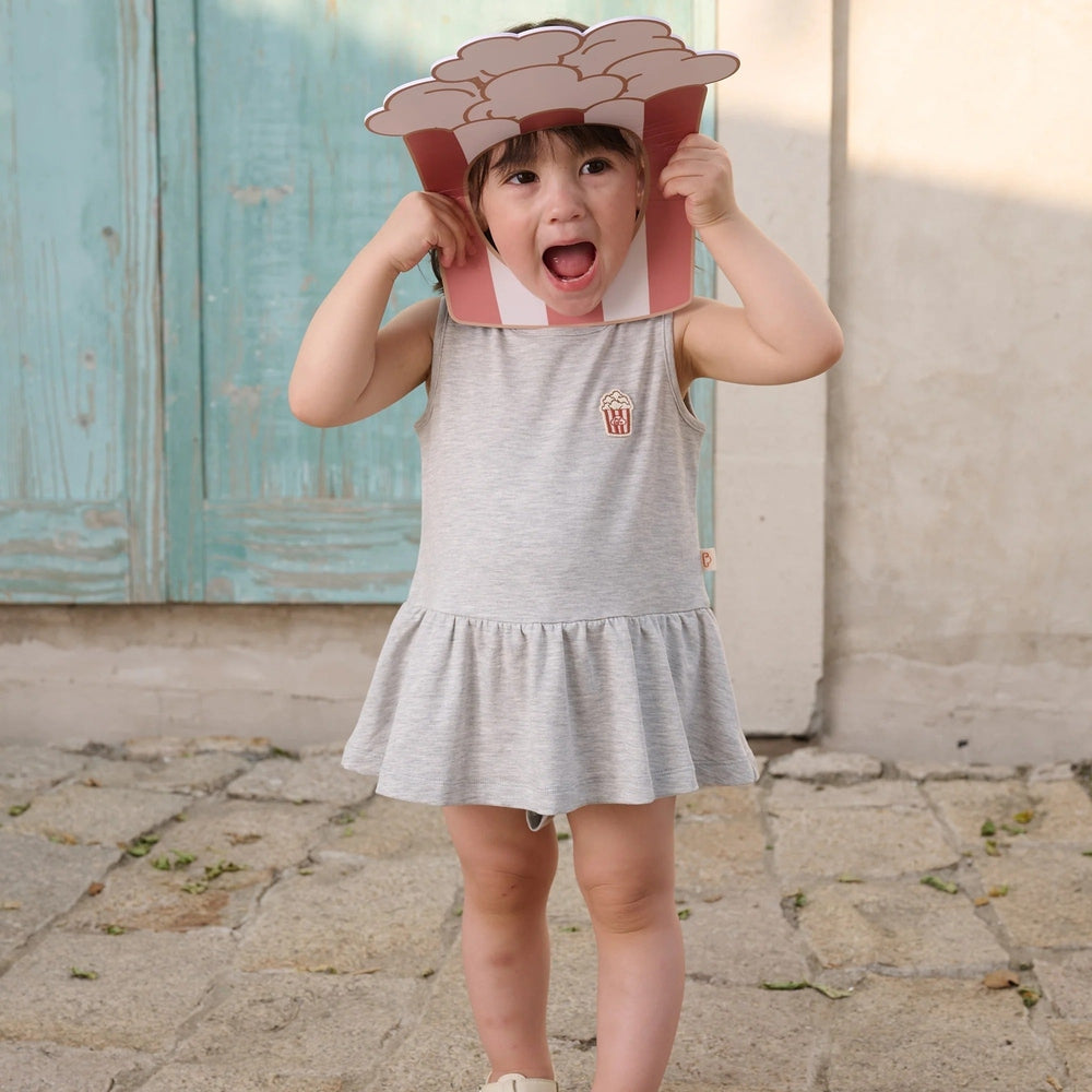 PETITE REVERY Petite Revery Baby Dress - Fog Grey sleeveless drop waist with ruffle skirt and popcorn patch img 1/6