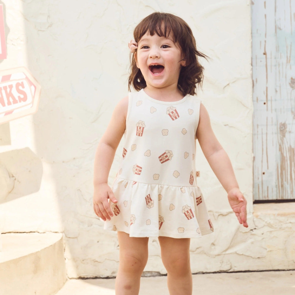 PETITE REVERY Petite Revery Baby Dress - Showtime popcorn print with drop waist and gathered ruffle hem img 1/6