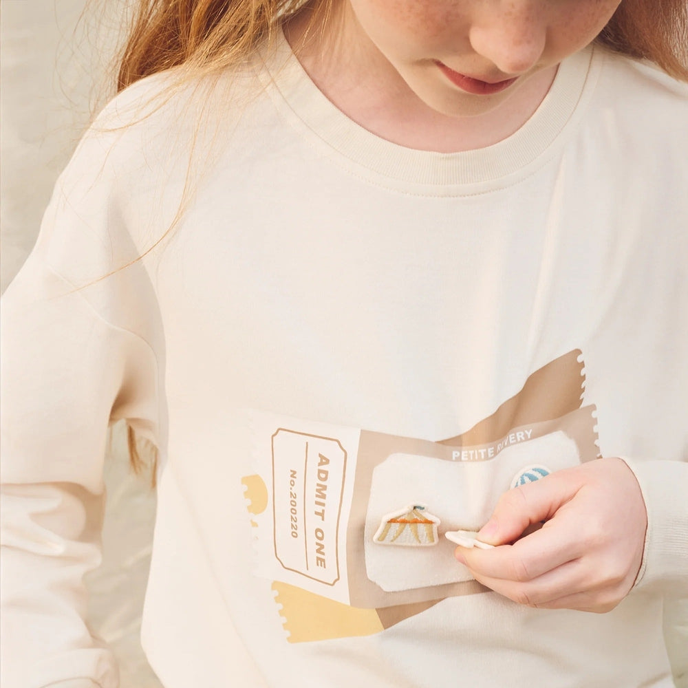 PETITE REVERY Petite Revery Long Sleeve Sweatshirt - Jet Stream Admission ticket graphic with detachable tent applique pocket img 3/6