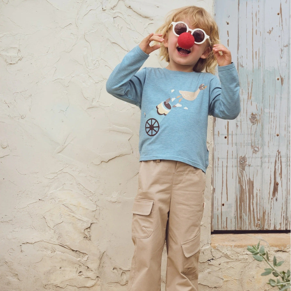 PETITE REVERY Petite Revery Long Sleeve Tee Meadow Green circus cannon performer graphic with wheel detail img 1/6