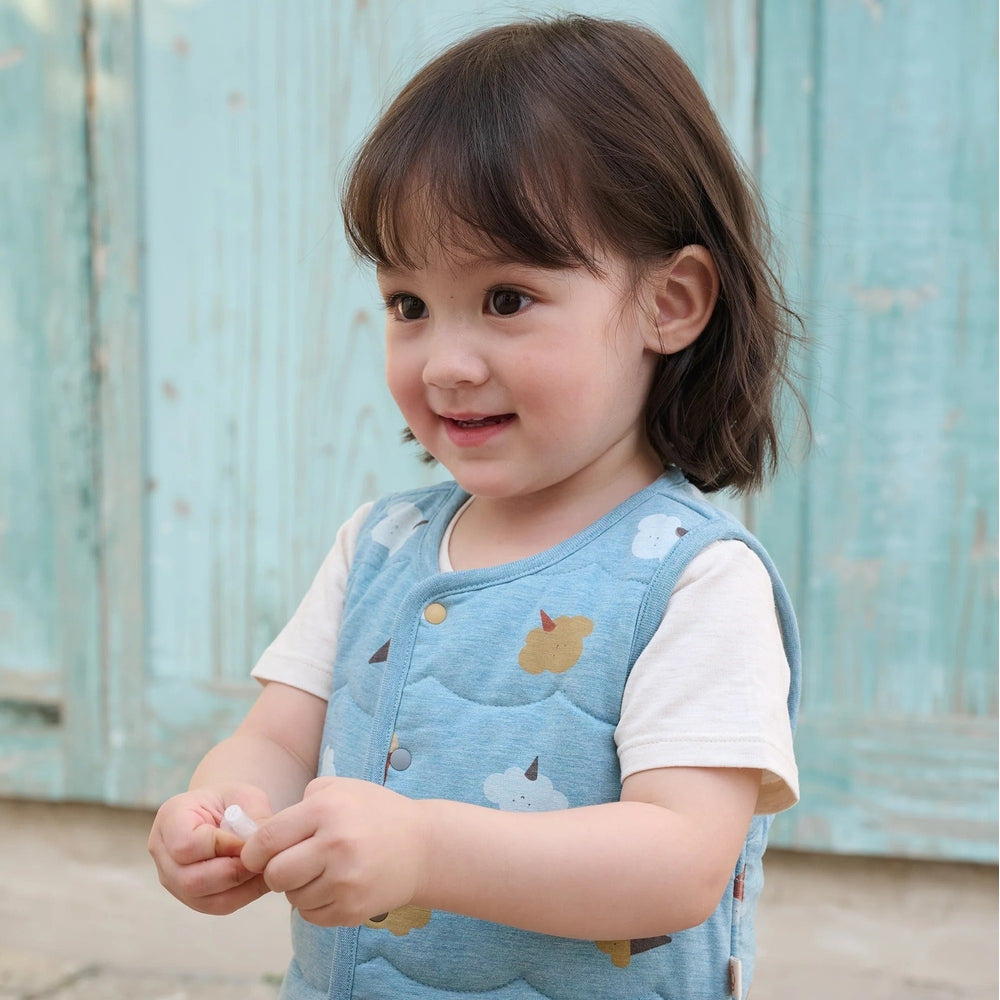 PETITE REVERY Petite Revery Quilted Reversible Vest Cloudy Cotton Candy snap button closure with animal applique pocket img 1/9