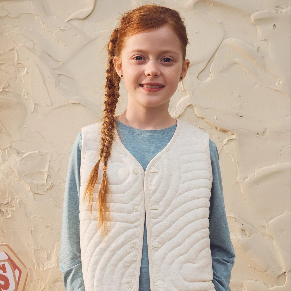 PETITE REVERY Petite Revery Quilted Reversible Vest Nimbus Cloud Button-front closure with wavy quilted stitching pattern img 1/9