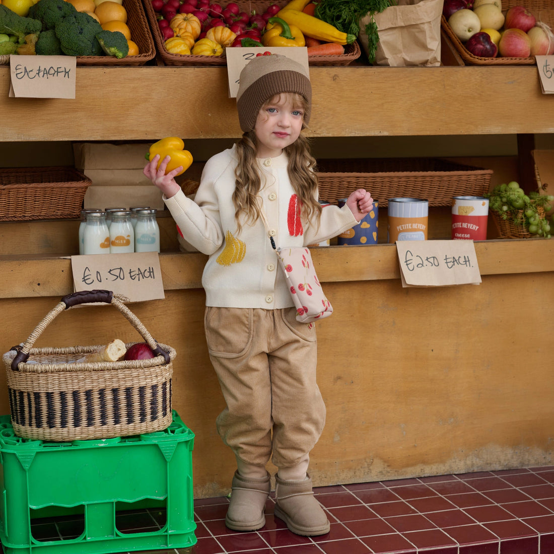 Petite Revery Tomato Beanie in Toast, child styling the Toast beanie