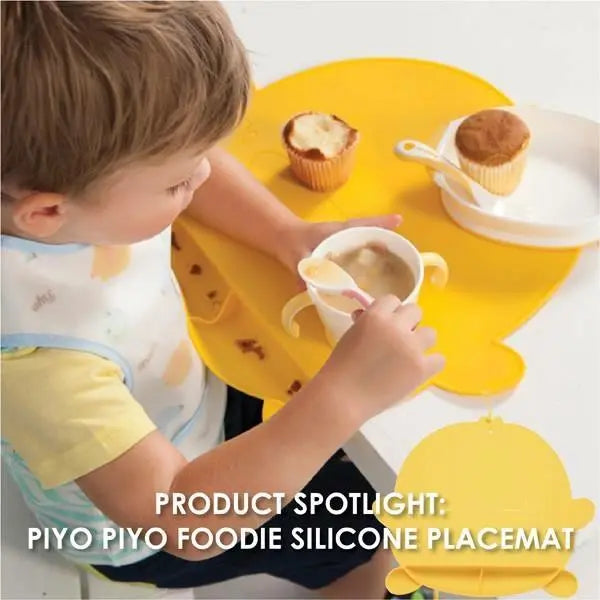 Piyo Piyo Foodie Silicone Placemat Yellow; child uses placemat to catch spills during mealtime.