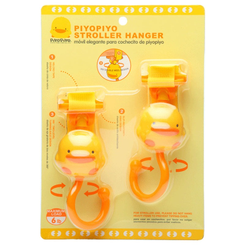 Piyo Piyo Stroller Hanger set; yellow duck heads on orange hooks, two pieces clipped to a stroller handle.