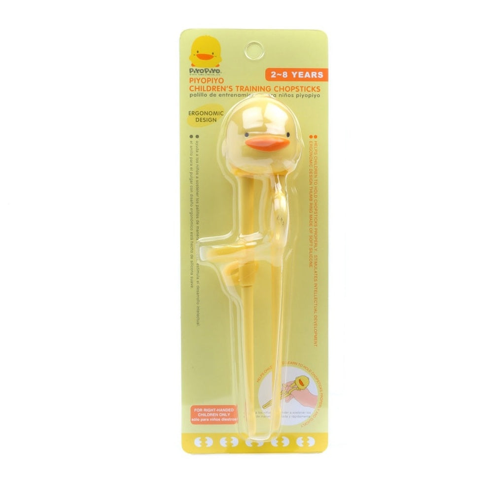 Piyo Piyo Training Chopsticks for children, yellow duck head with ergonomic handles on packaging.