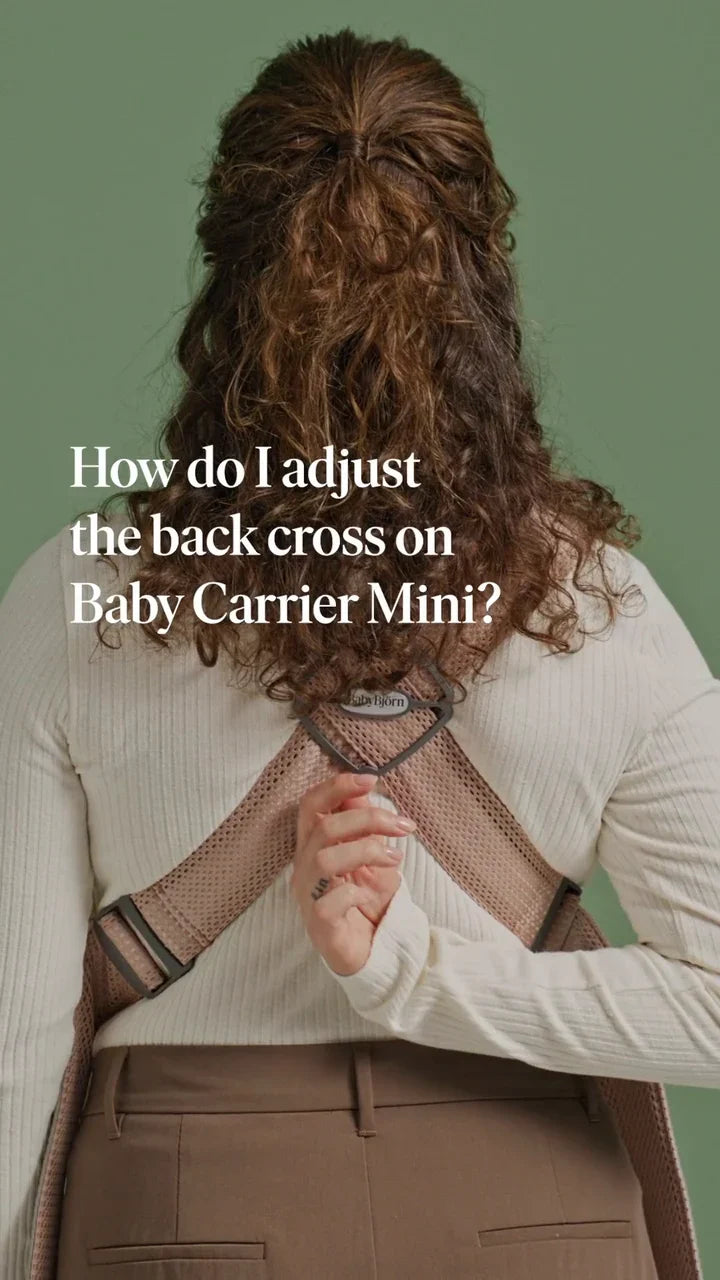 How do I adjust the back cross on my baby carrier?