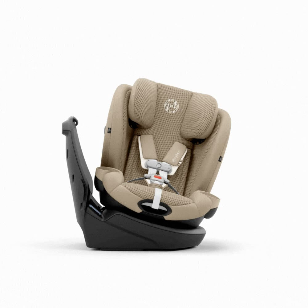 Cybex Callisto G 360 Rotating All-In-One Convertible Car Seat in Almond Beige rear-facing with black base and canopy, three-quarter side view