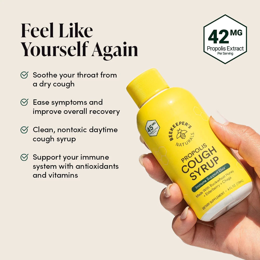 Beekeeper's Naturals Propolis Cough Syrup Daytime 118 ml, a yellow bottle held in hand highlighting cough relief benefits.