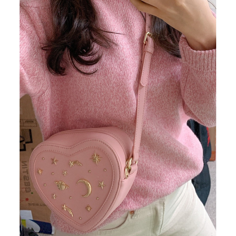 Puttisu My Bling Heart Bag; pink heart-shaped crossbody with gold celestial studs and adjustable strap