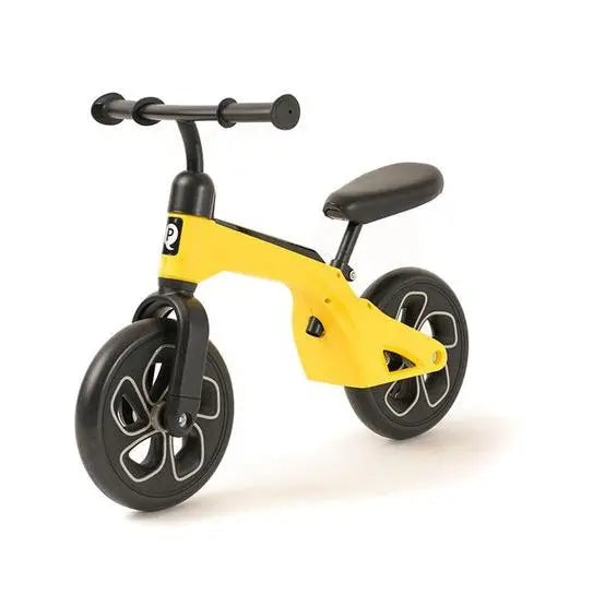 QPLAY Balance Bike for toddlers in yellow frame, black handlebars and wheels, shown ready to ride.