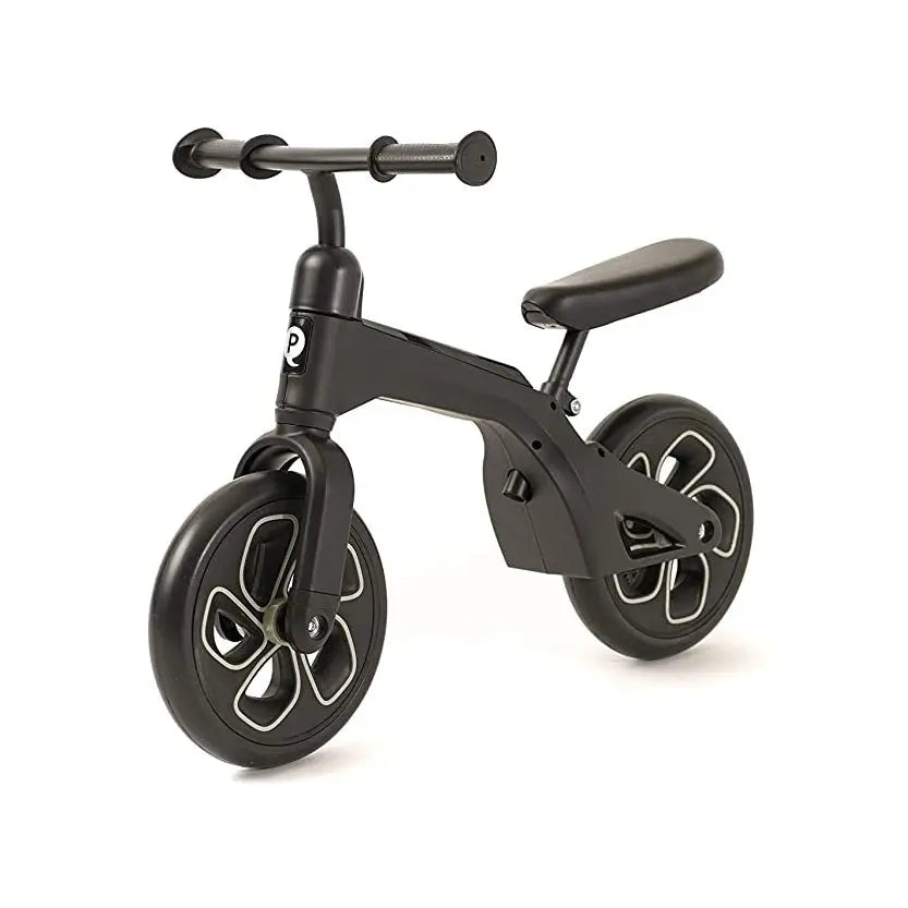 QPLAY Balance Bike in black with cushioned seat and chunky sculpted wheels, shown ready for a young rider.