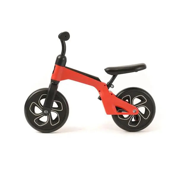 QPLAY Balance Bike red frame with black wheels and seat, ready for a toddler to ride