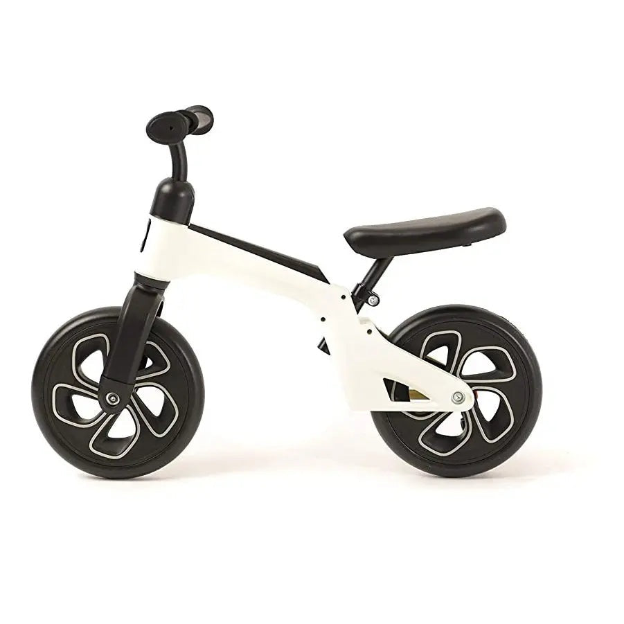 QPlay Balance Bike white frame with black wheels and saddle, ready for toddlers to ride.