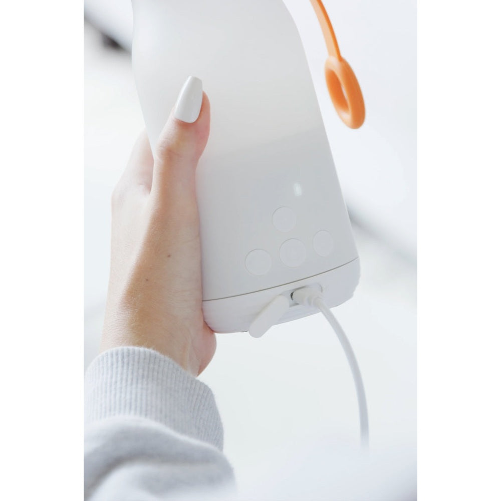 Quark Buubibottle portable milk warmer, white handheld with control buttons and cord
