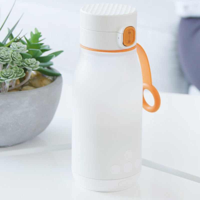 QUARK Buubibottle smart portable milk warmer bottle, white with orange handle and lid