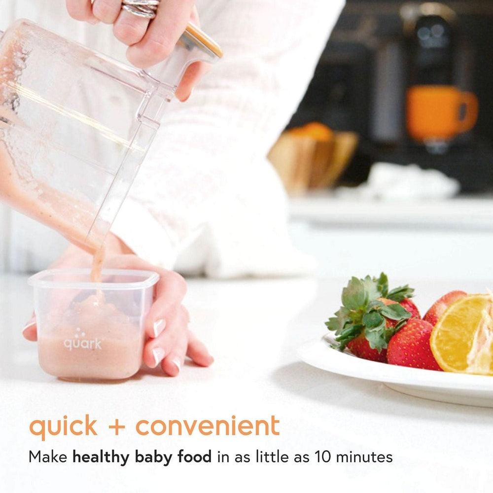 Quark Quook 5-in-1 baby food processor blending peach puree in a clear cup