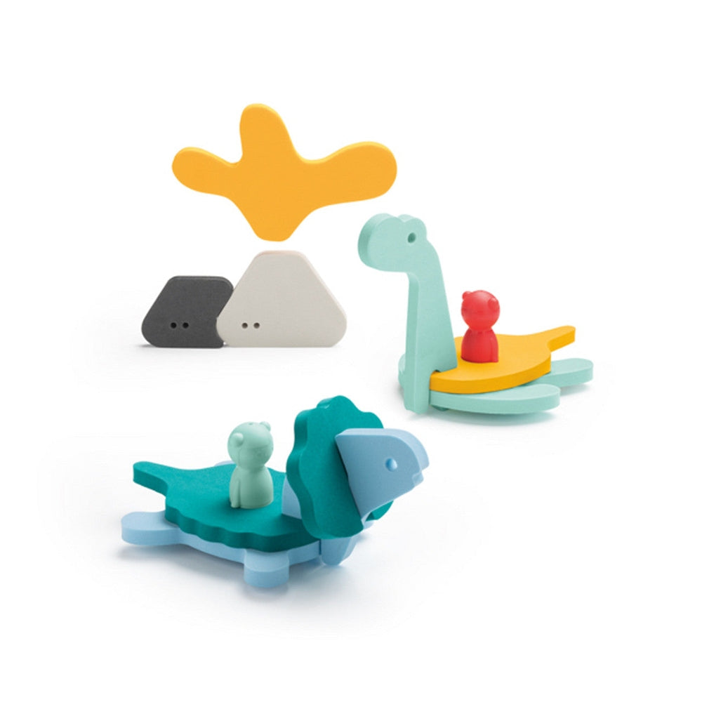 Quutopia Puzzle Friends by BABY ENROUTE, pastel dinosaur stackers with tiny figures perched on a layered platform.