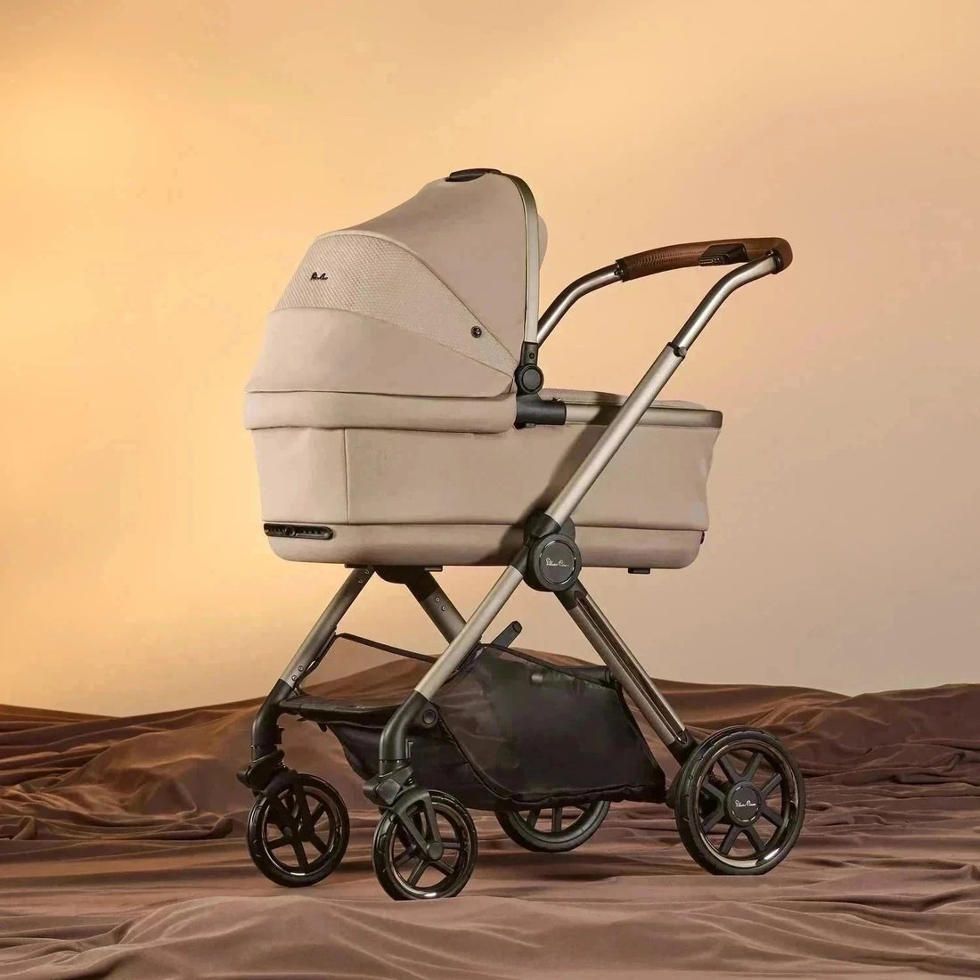 Silver Cross Reef 2 First Bed Folding Bassinet in Frappé — bassinet mounted on Reef 2