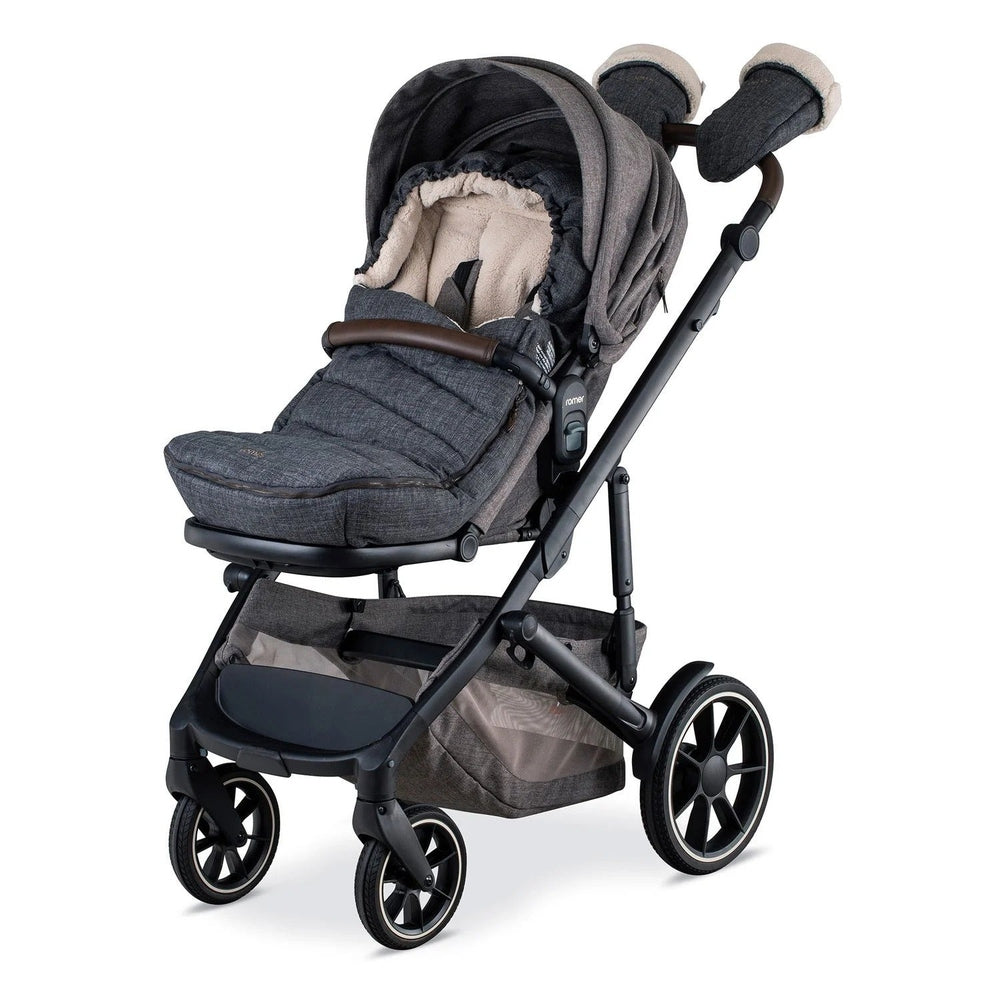 Romer Tura Winter Kit (Cover + Gloves) on a dark stroller; mittens clipped to the handle for cold weather.