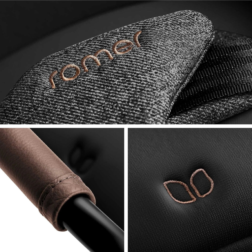 Romer Veni Convertible Car Seat in charcoal knit fabric with brown stitching, padded carry handle, and ROMER badge.