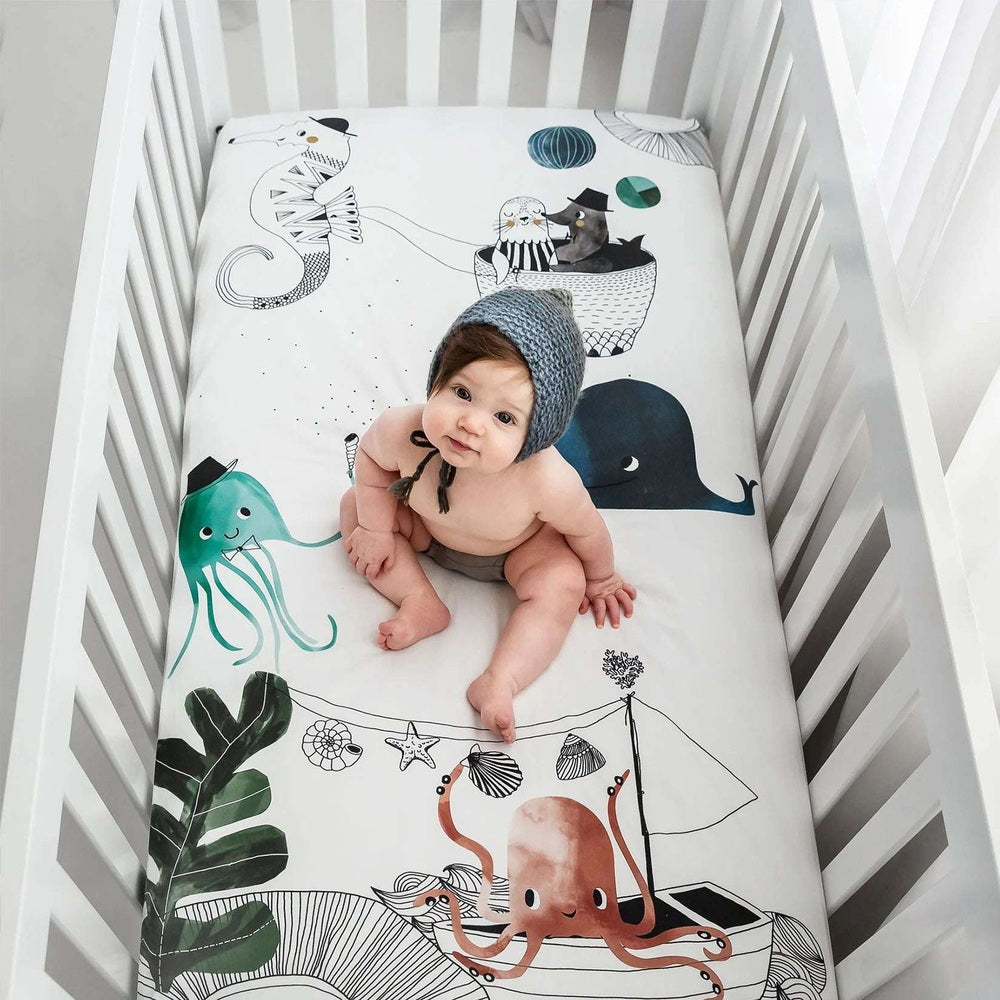 Rookie Humans crib sheet in cotton sateen with underwater sea creatures on white background