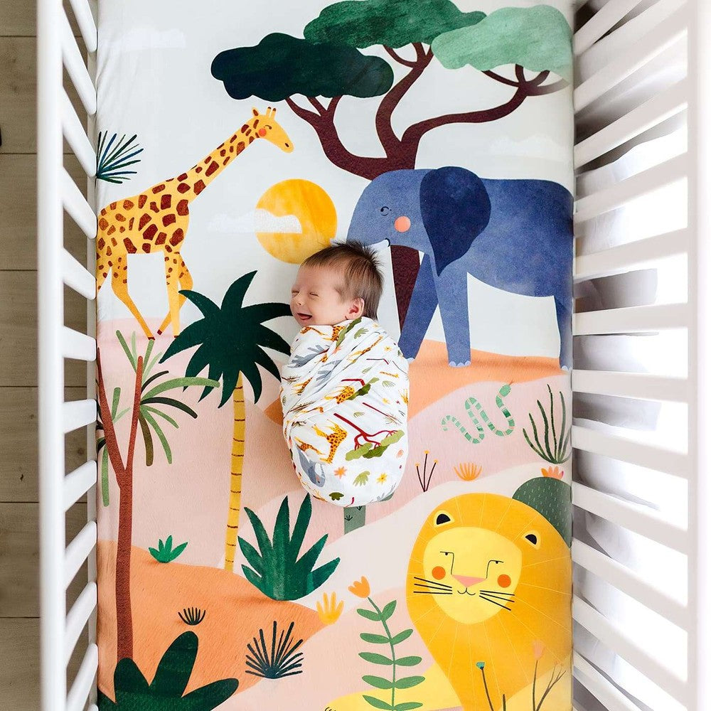 Rookie Humans Savanna crib sheet in cotton sateen with giraffe, elephant, and lion design