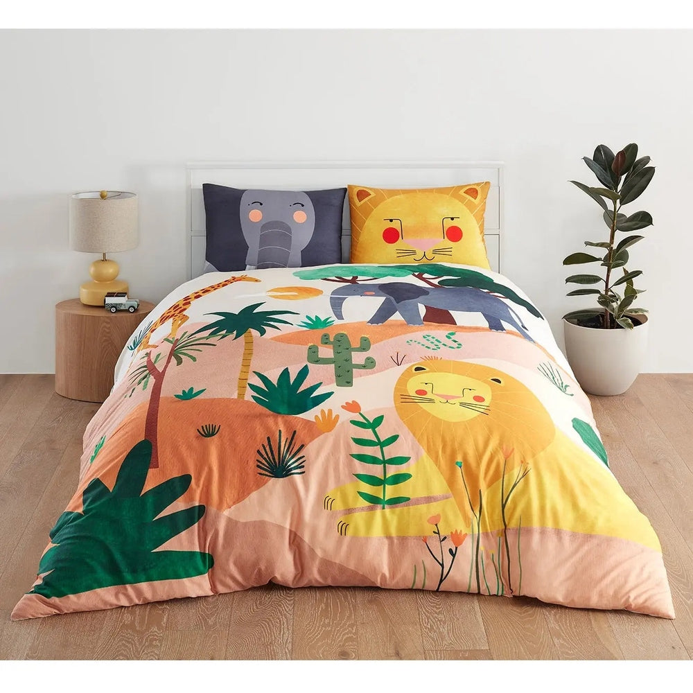 Rookie Humans Kids Bedding Set in the Savanna, bright safari print duvet cover with lion and elephant pillowcases on a bed