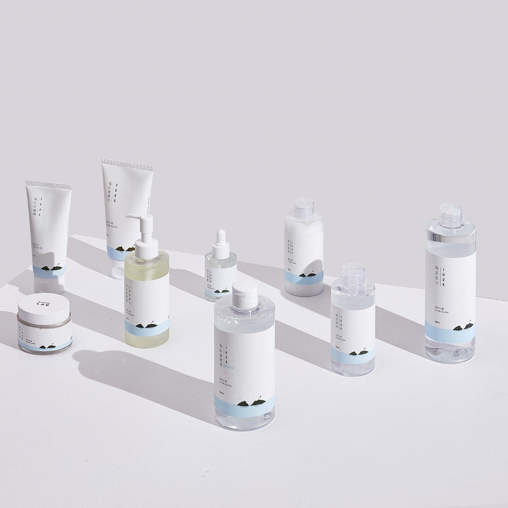 Round Lab 1025 Dokdo Mud Pack 100 ml kit of skincare bottles with white labels and light blue bands