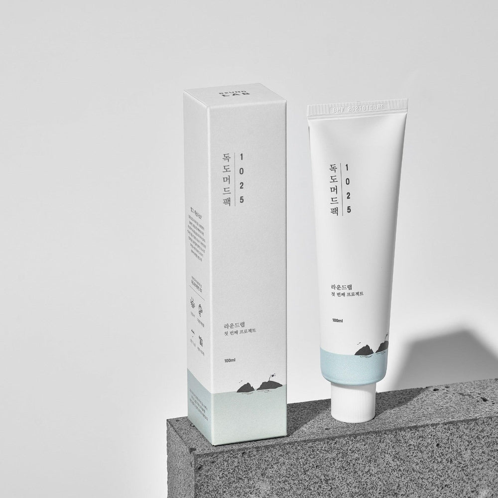 Round Lab 1025 Dokdo Mud Pack 100 ml; white tube with pale blue band beside its box.