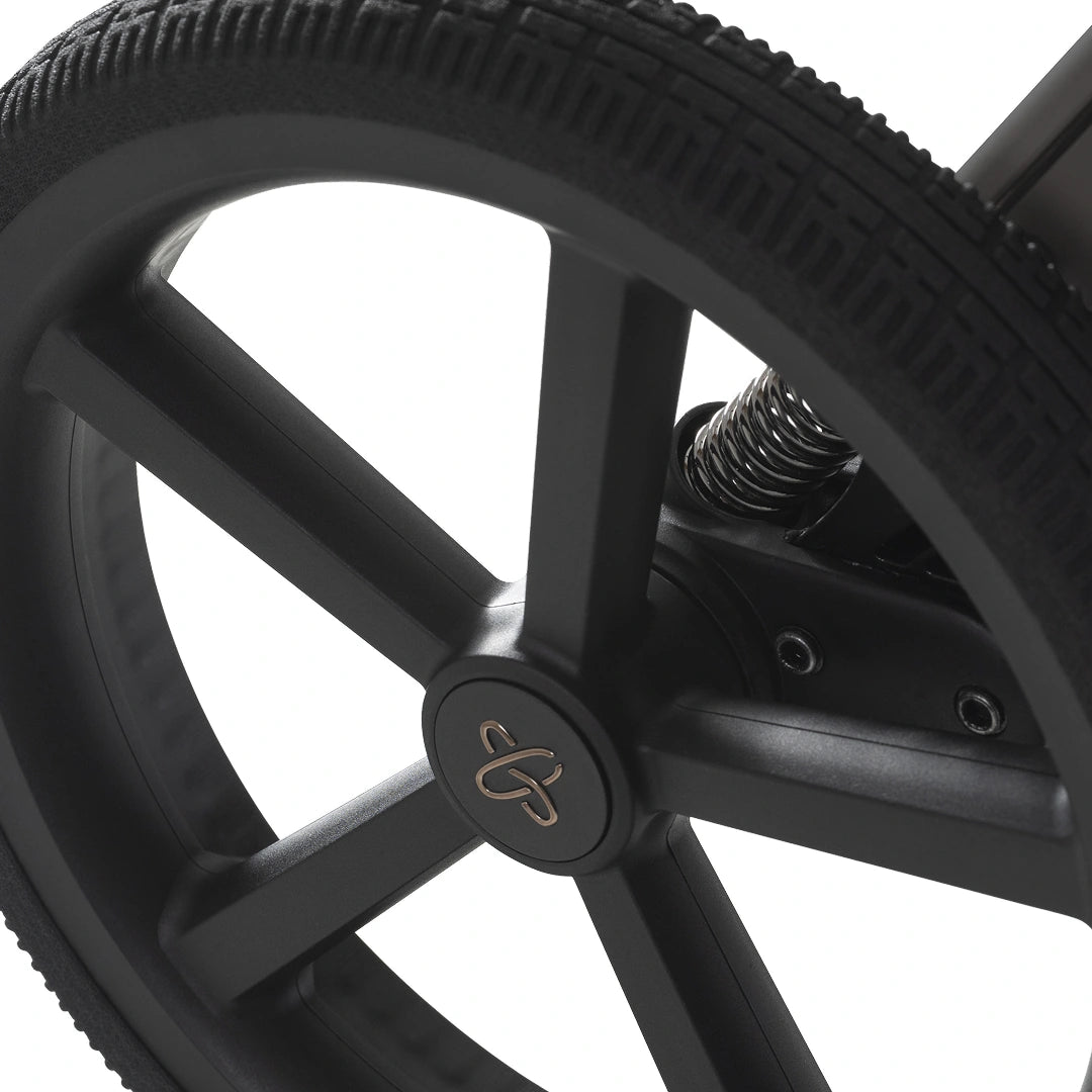 Close-up of the Cove 2 rear wheel and suspension spring.