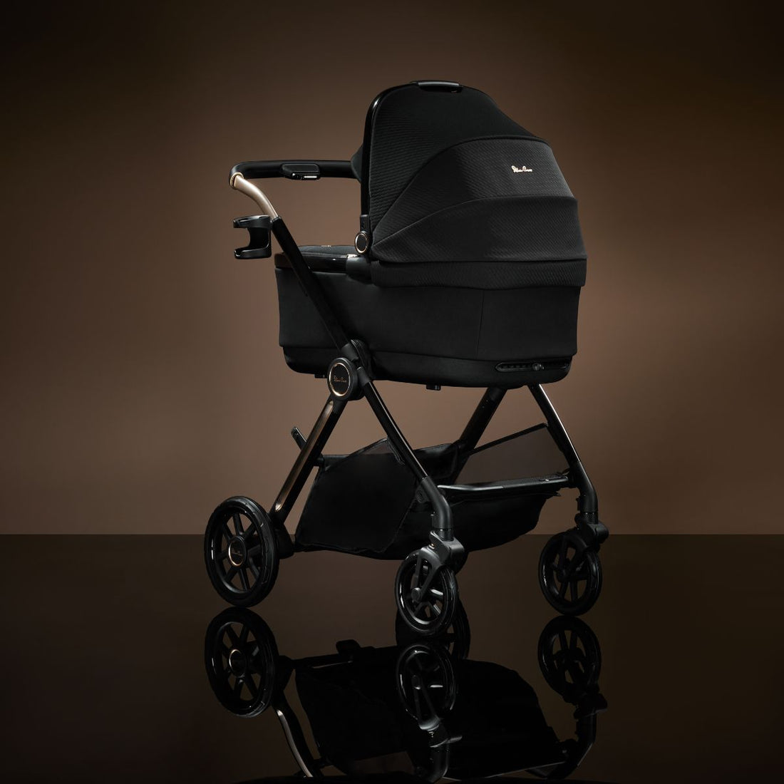 Silver Cross Reef 2 First Bed Folding Bassinet in Espresso — bassinet three-quarter view