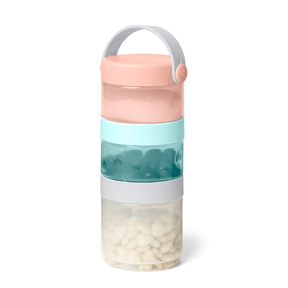 Skip Hop formula to food containers stack in pastel pink, mint, teal, and clear jars with a gray carry handle
