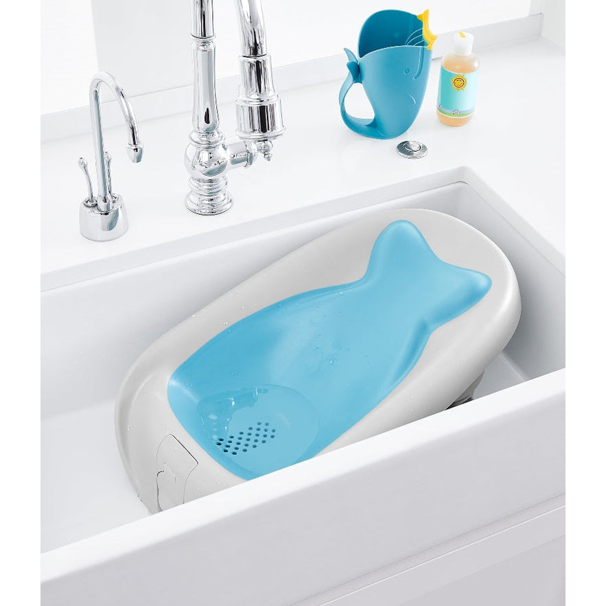 Skip Hop Moby blue reclining baby bath seat, whale-shaped in sink