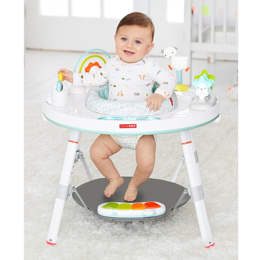 Skip Hop Silver Lining Cloud Baby's View Activity Center; white frame with pastel accents and colorful toys