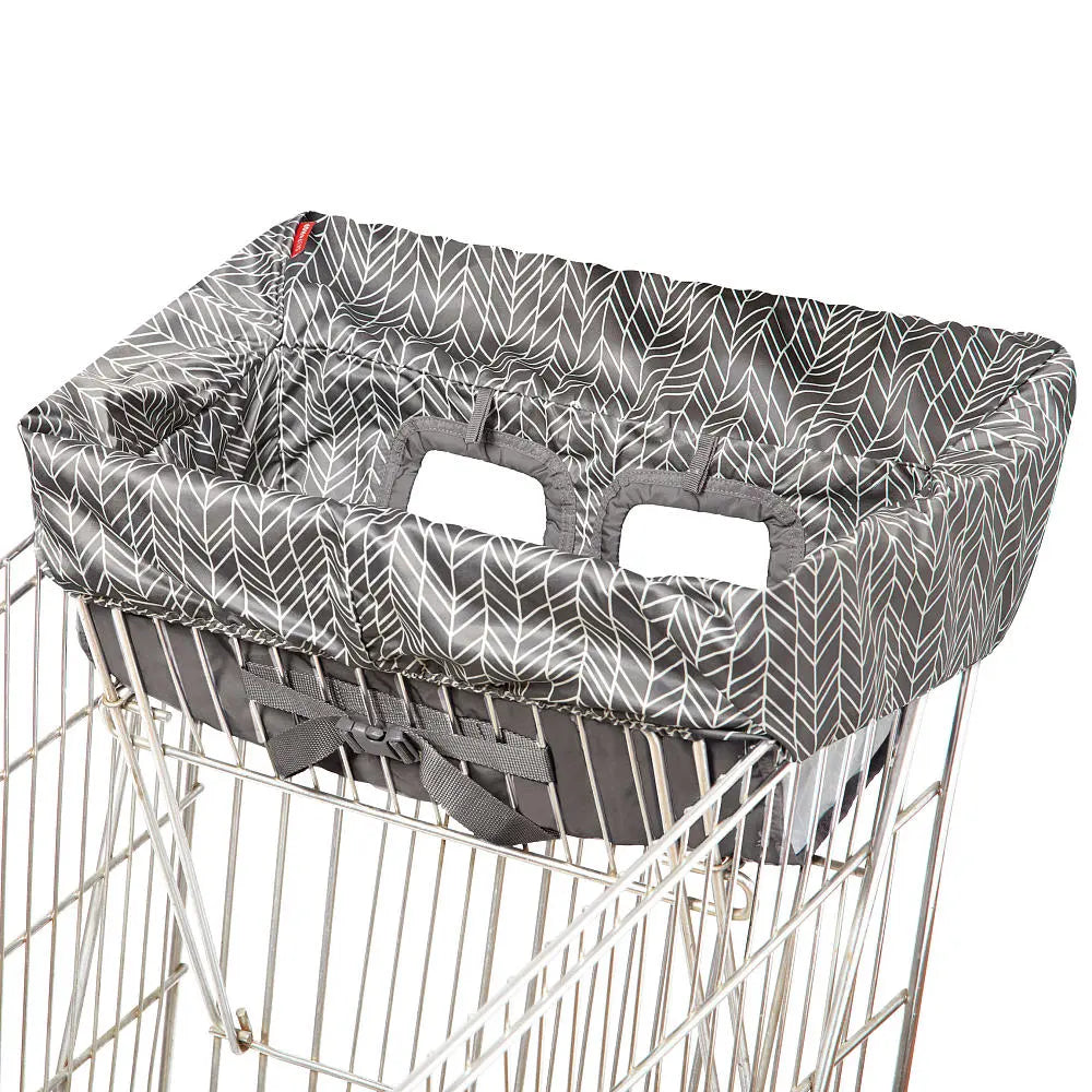 Skip Hop Take Cover shopping cart and high chair cover in grey leaf fabric attached to a shopping cart with padded handles.