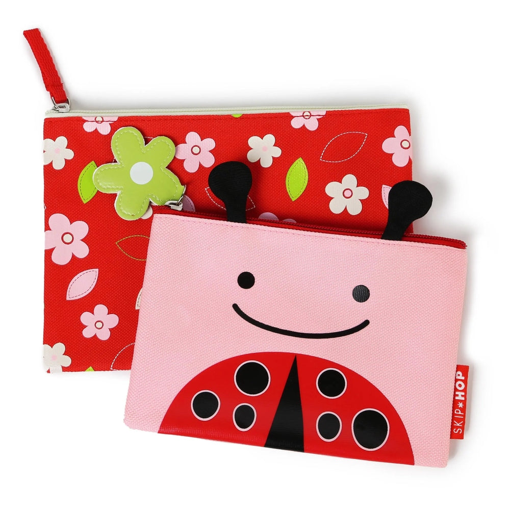 Skip Hop Zoo Kid Cases: red floral zip pouch with green flower charm paired with pink smiling ladybug pouch.