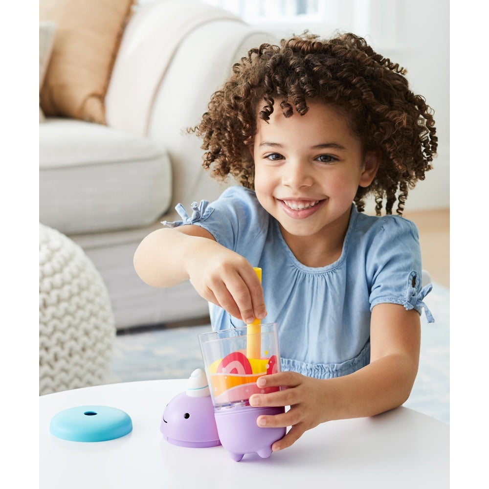 Skip Hop Zoo Shake It Up Smoothie Set purple blender base with colorful fruit shapes, child playing.