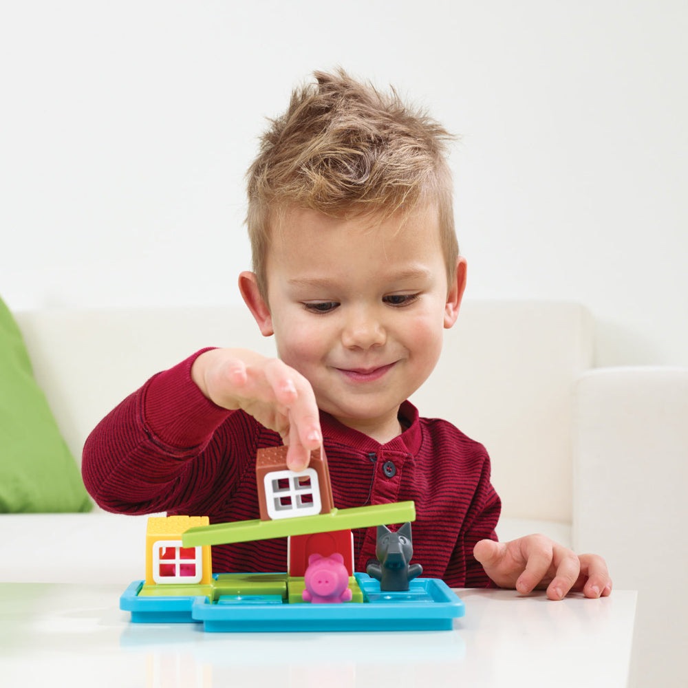 Smart Games 3 Little Piggies Deluxe educational toy set with colorful blocks and pig figures