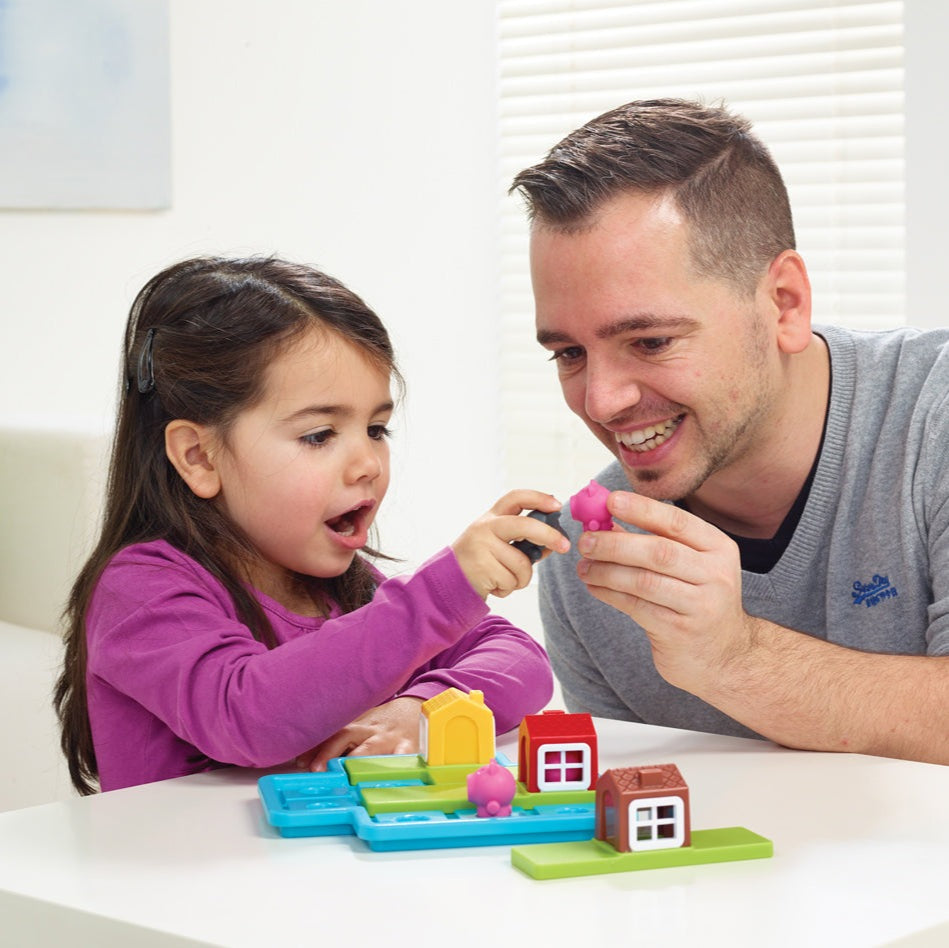Smart Games 3 Little Piggies Deluxe educational toy set with bright plastic houses and tiles