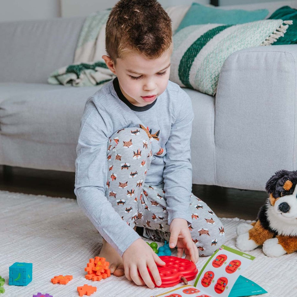 Smart Games Apple Twist puzzle toy in red, kids' educational game by SMART GAMES.
