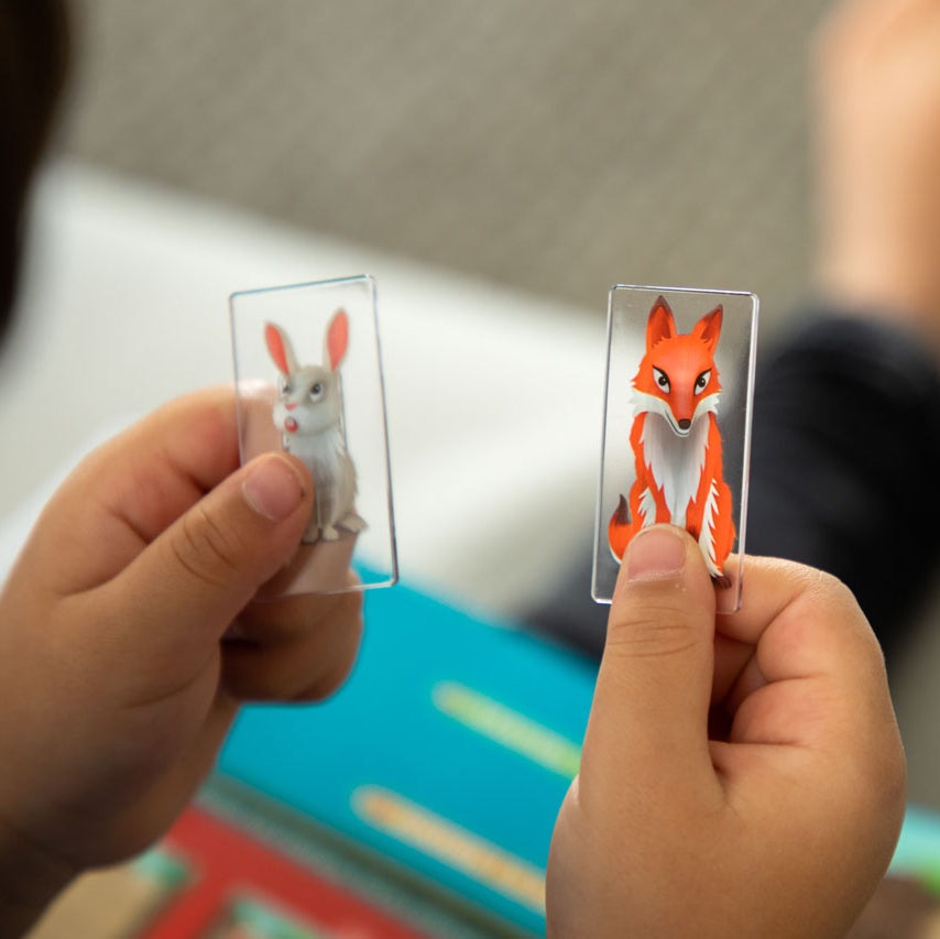 Smart Games Down The Rabbit Hole: two cards with a bunny and a fox in clear plastic sleeves
