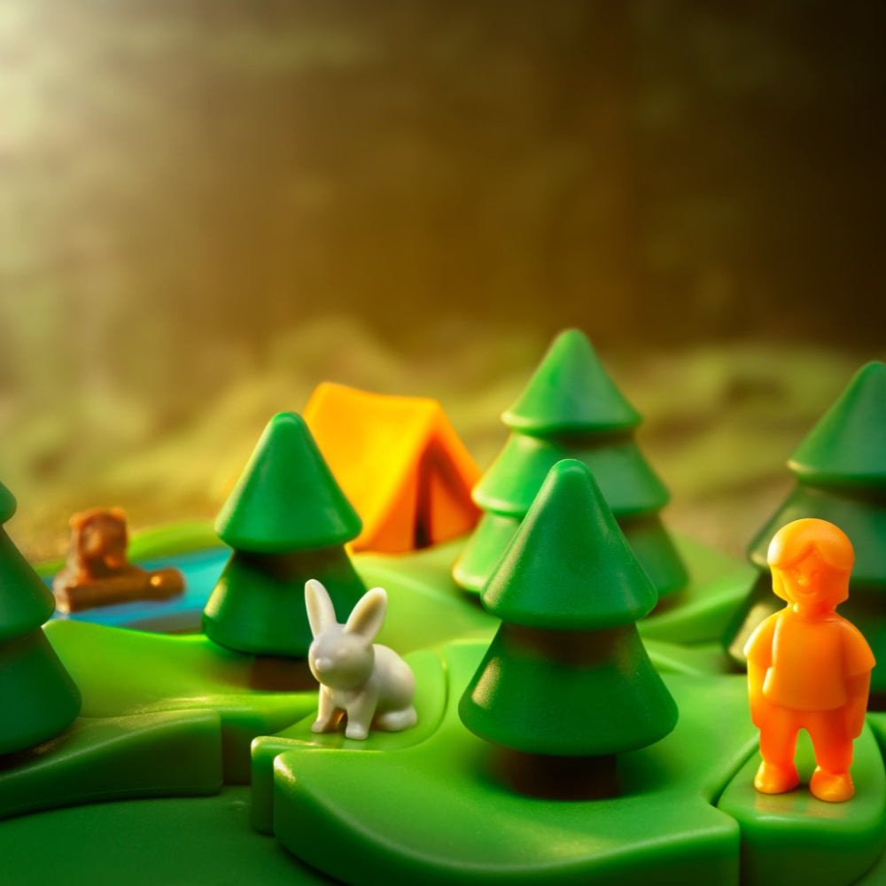 Smart Games Grizzly Gears playset featuring green trees, an orange figure, and a white rabbit